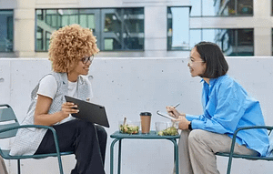 An Image Of A Female Client And A Female Freelancer Having Lunch As One Of The Habits Freelancers Needs To Develop To Become A Successful Freelancer