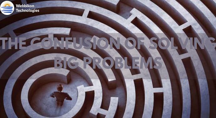 A man Standing In The Middle Of A Maze And An Inscription Which Says The Confusion Of Solving Big Problems